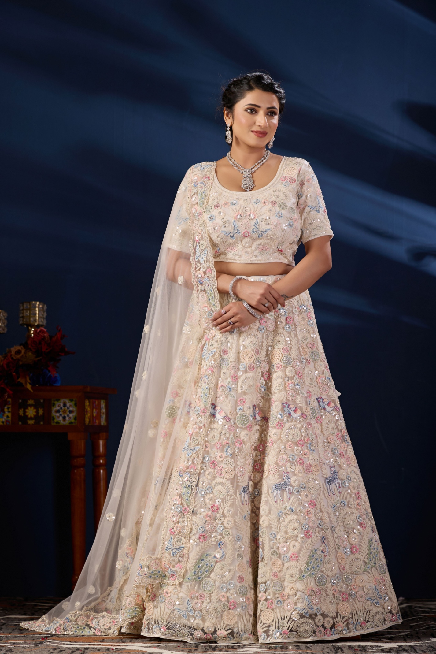 Ivory Cream Peacock Embroidered Net Lehenga Choli
