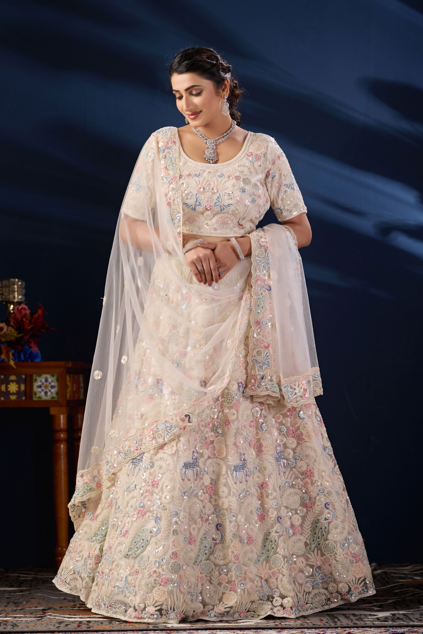 Ivory Cream Peacock Embroidered Net Lehenga Choli
