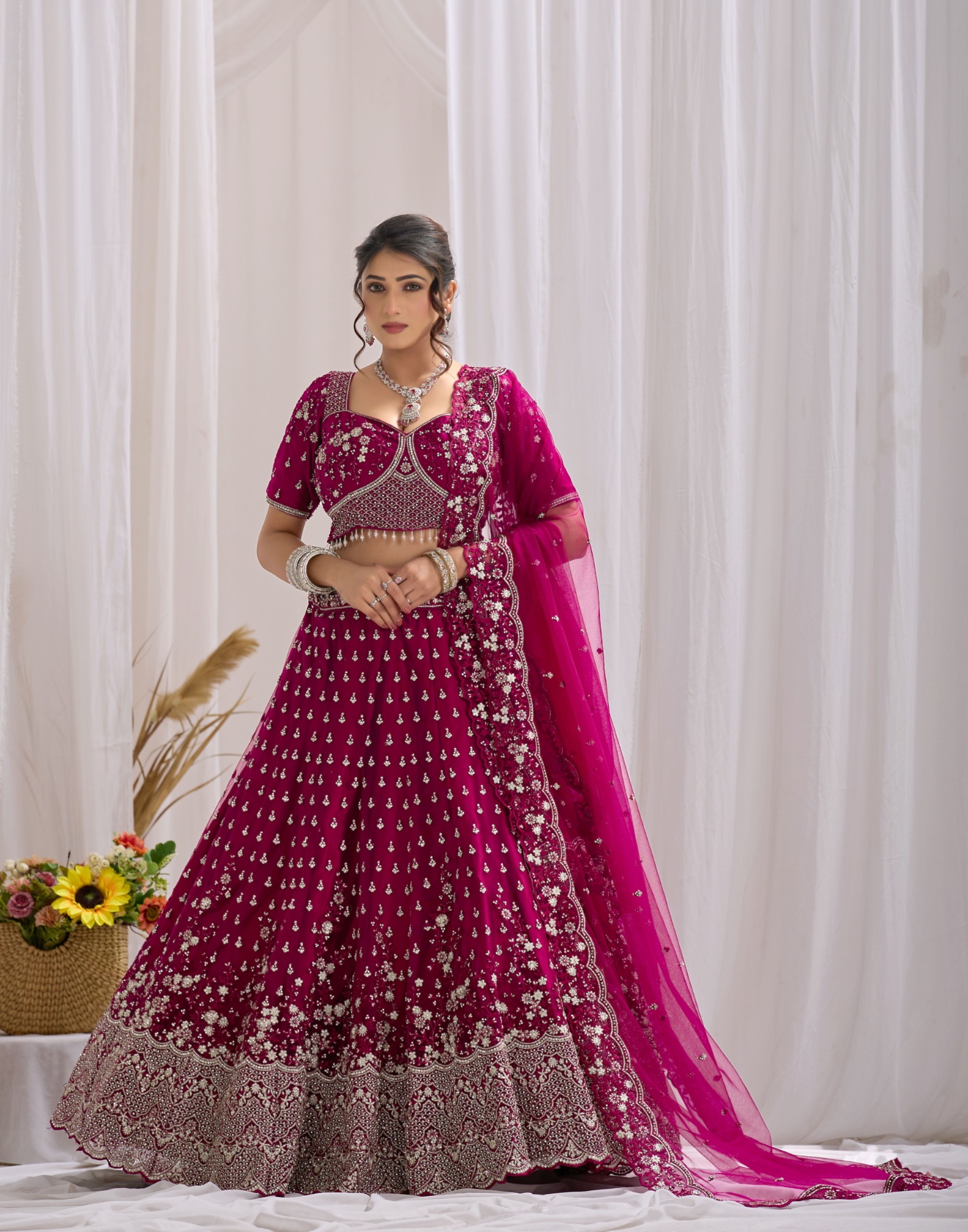 Magenta Ethnic Motif Embroidered Net Lehenga Choli