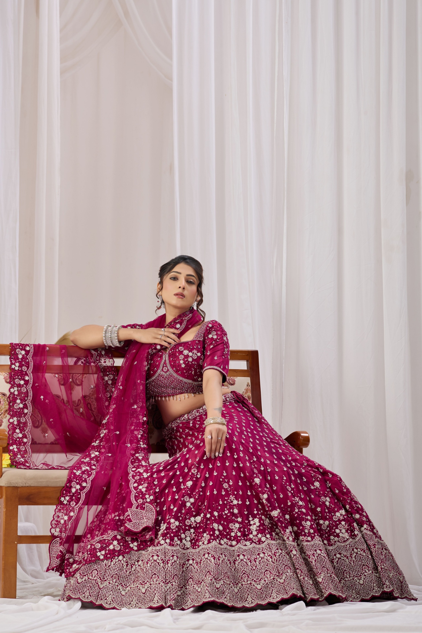 Magenta Ethnic Motif Embroidered Net Lehenga Choli
