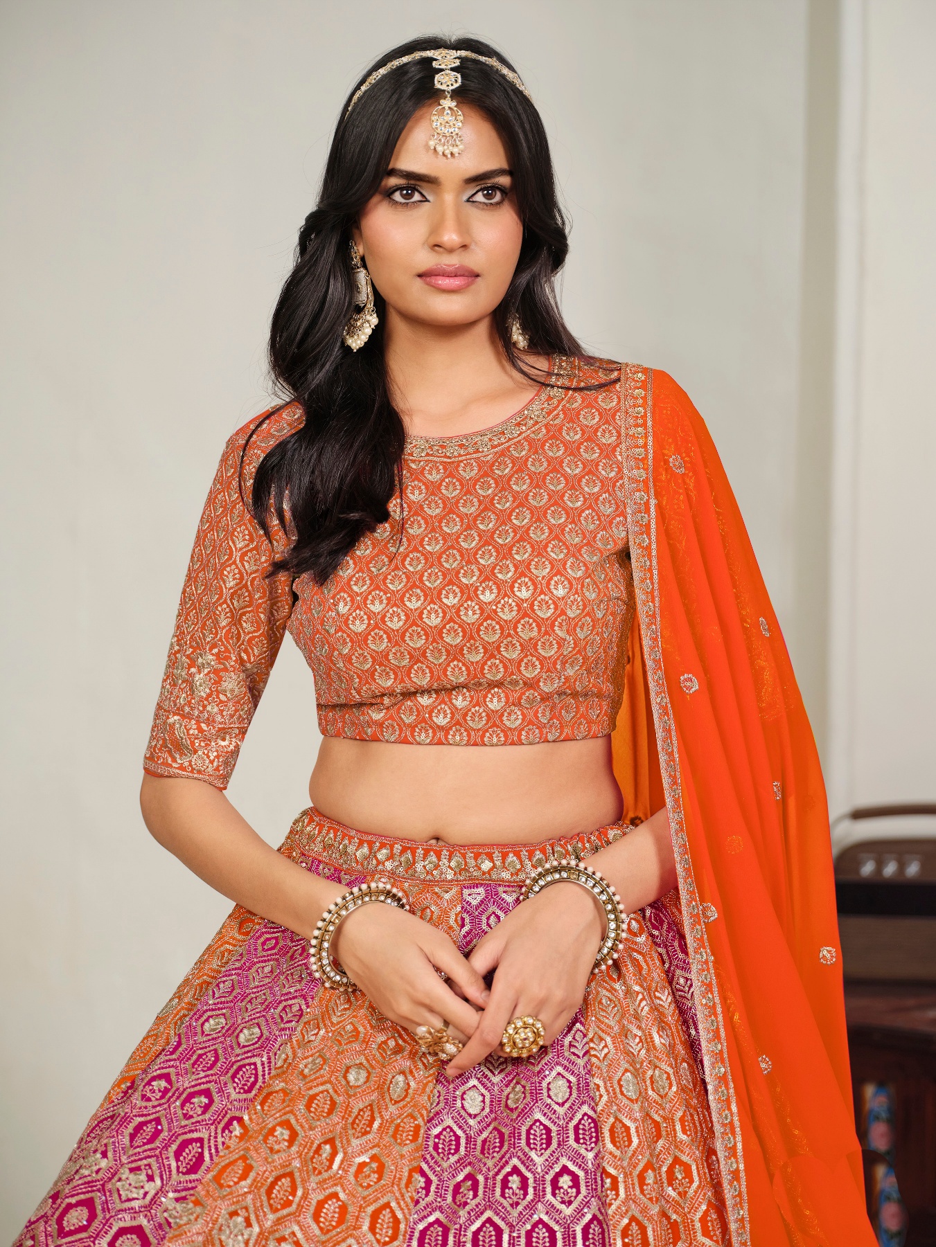 Orange Geometric Embroidered Faux Georgette Lehenga Choli