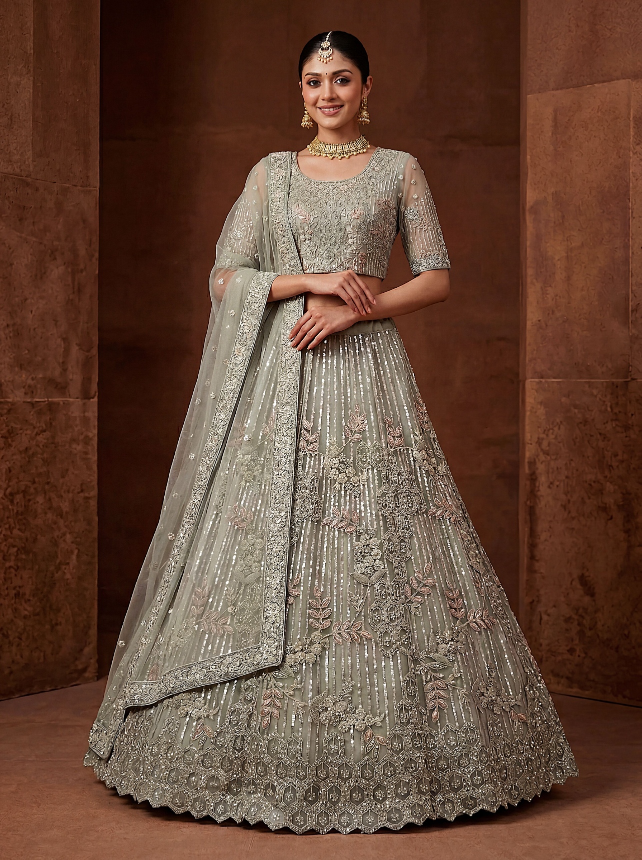 Pista Zircon Embroidered Net Lehenga Choli