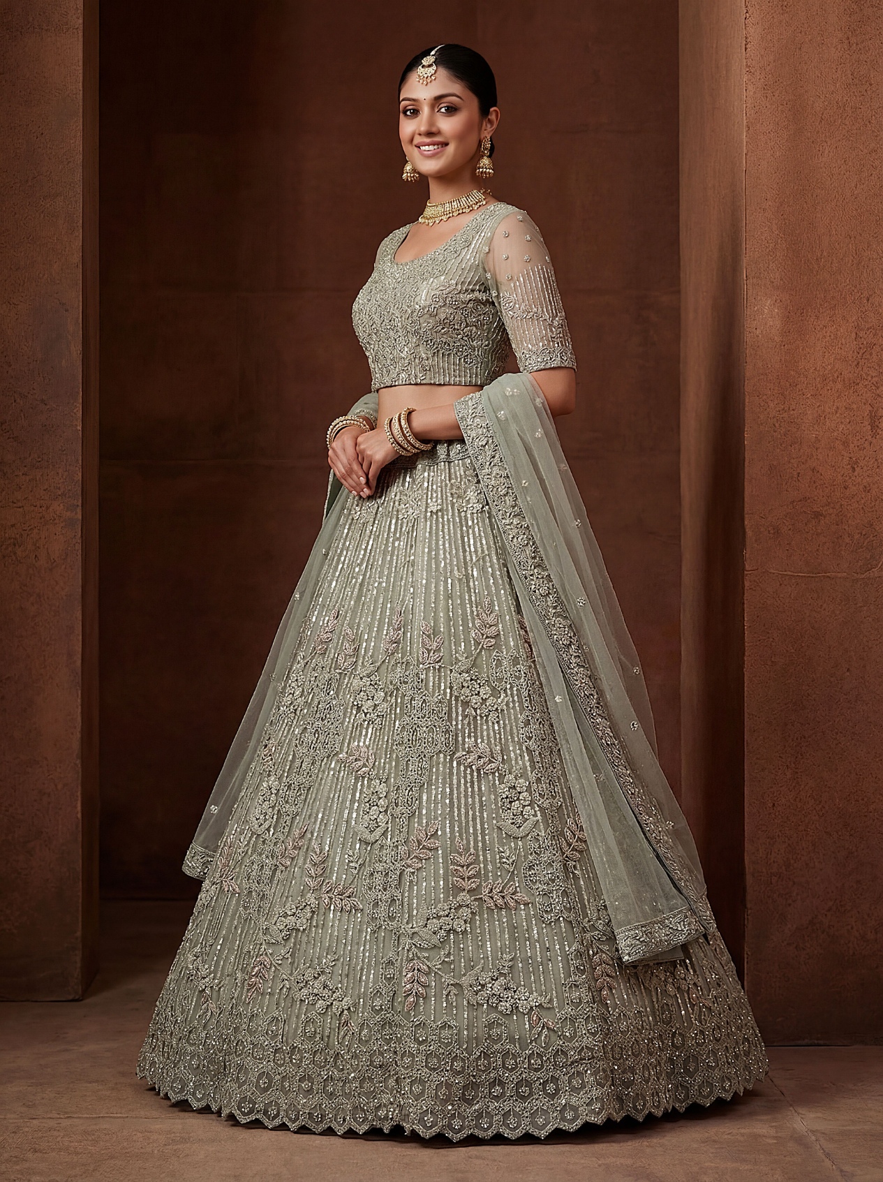 Pista Zircon Embroidered Net Lehenga Choli
