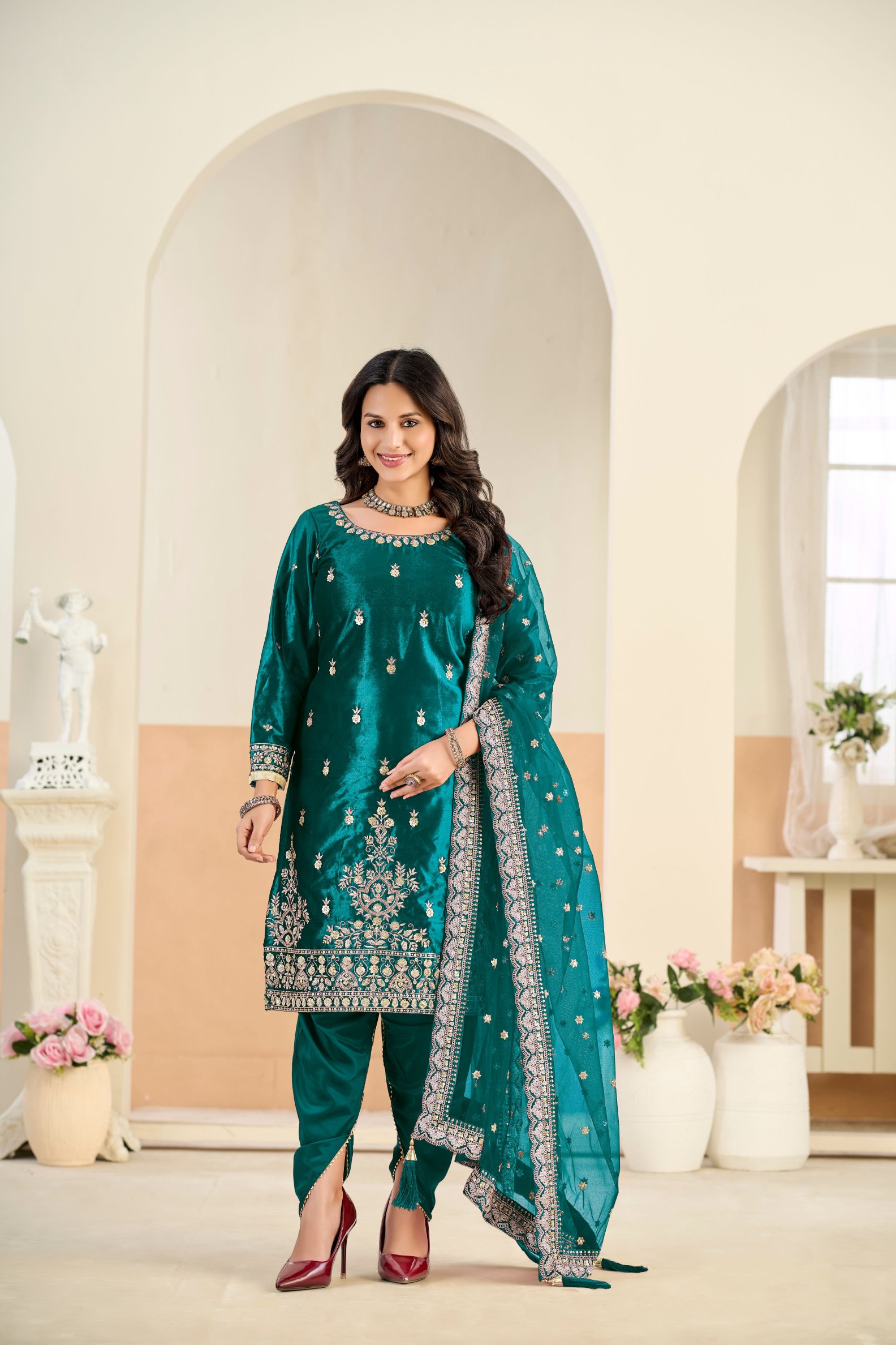 Rama Embroidered Velvet Salwar Suit