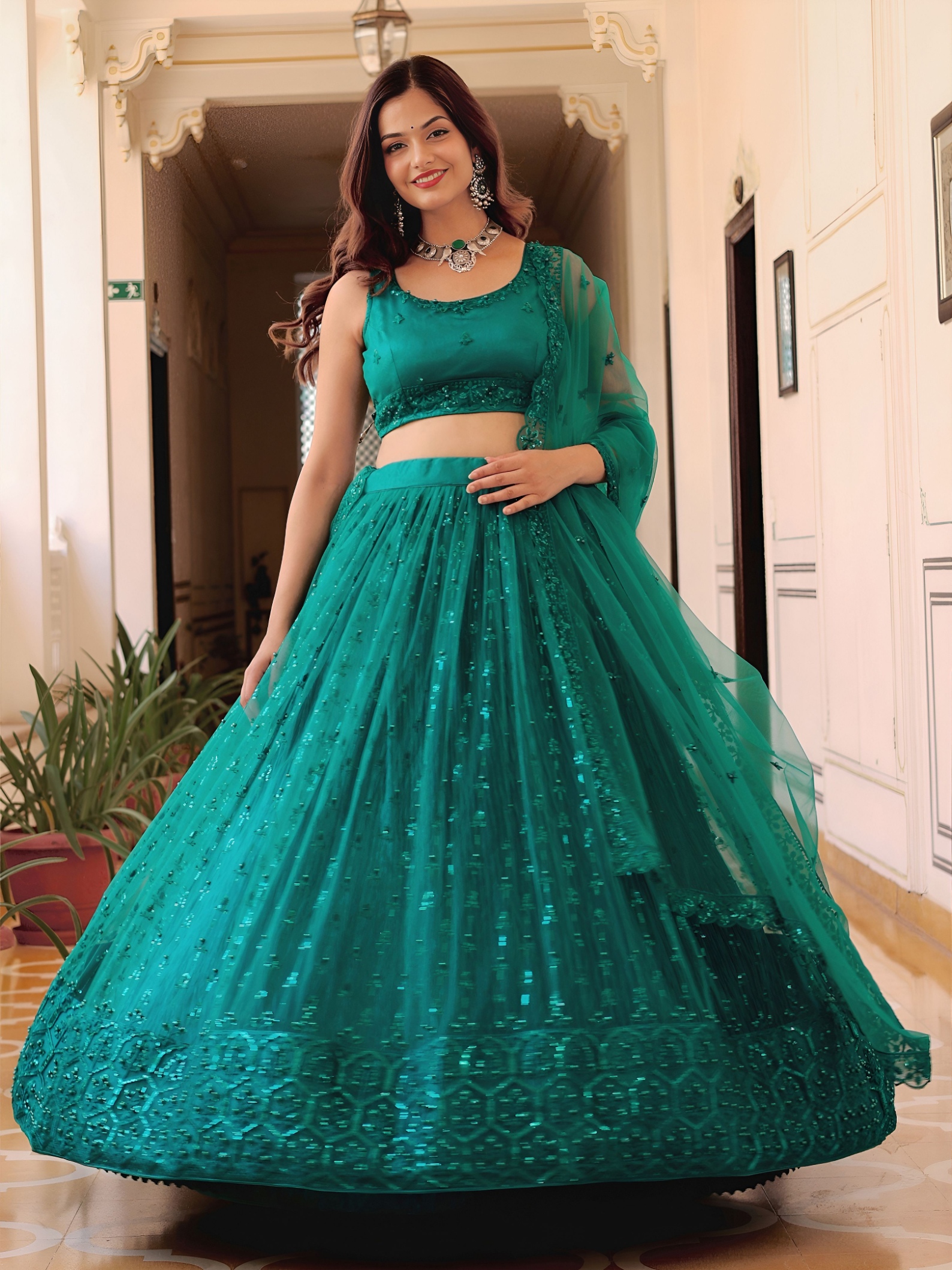 Teal Sequins Embroidered Soft Net Lehenga Choli