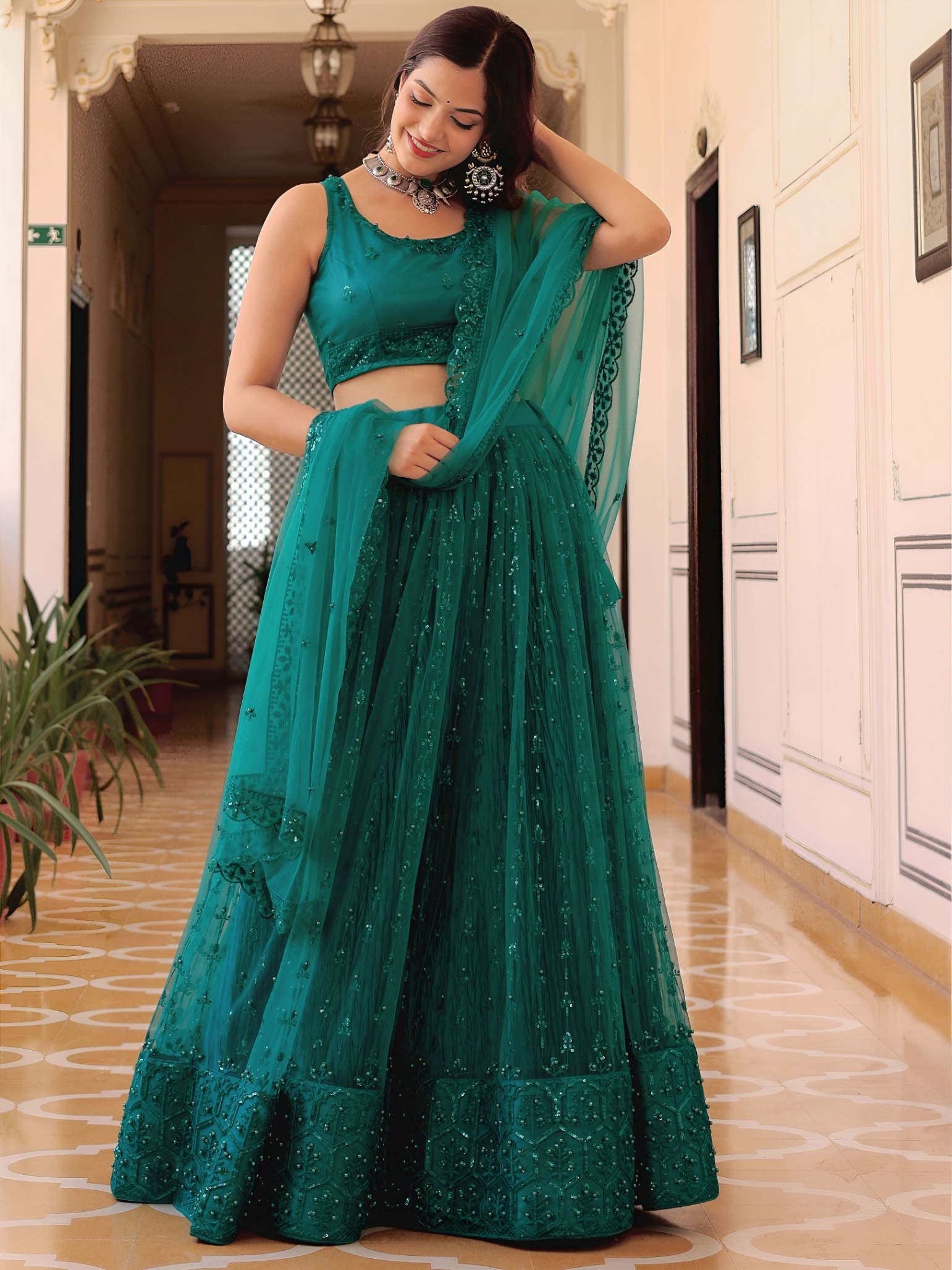 Teal Sequins Embroidered Soft Net Lehenga Choli